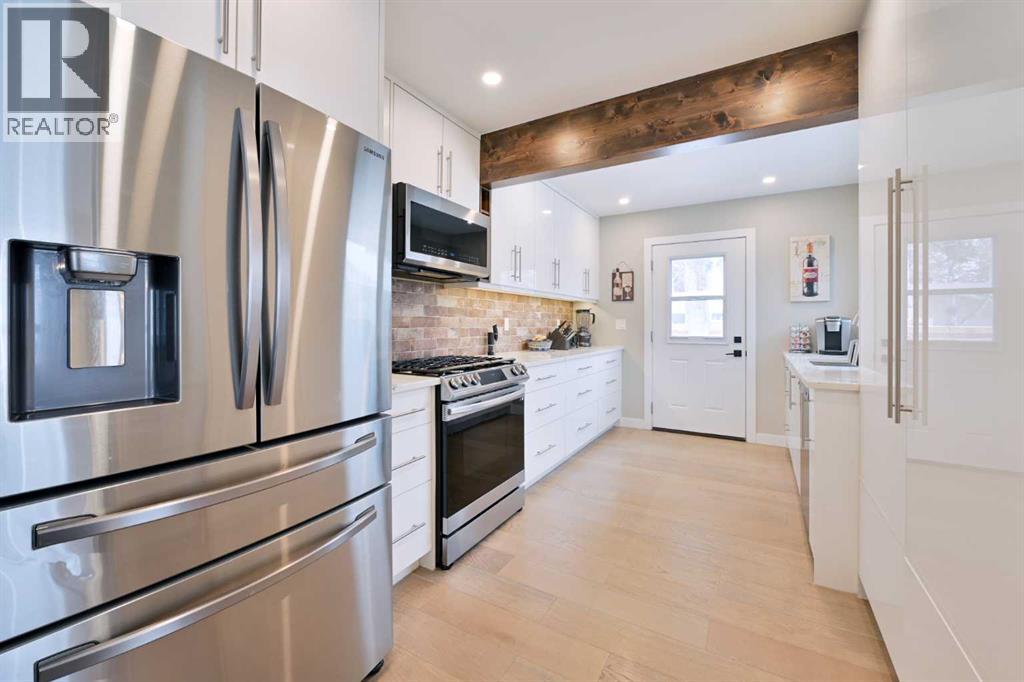 Single Family House Bungalow for Sale in  Lombardy Crescent SW North Glenmore Park Calgary 