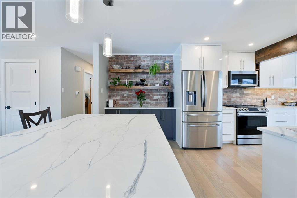 Single Family House Bungalow for Sale in  Lombardy Crescent SW North Glenmore Park Calgary 