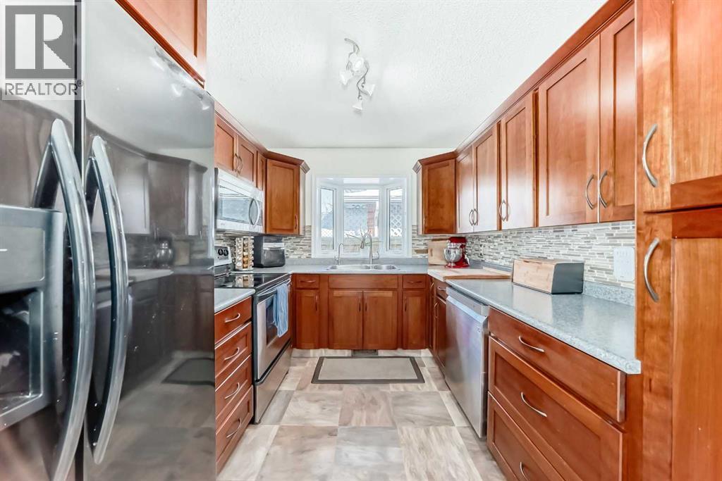 Single Family House Bungalow for Sale in  Midglen Way SE Midnapore Calgary 