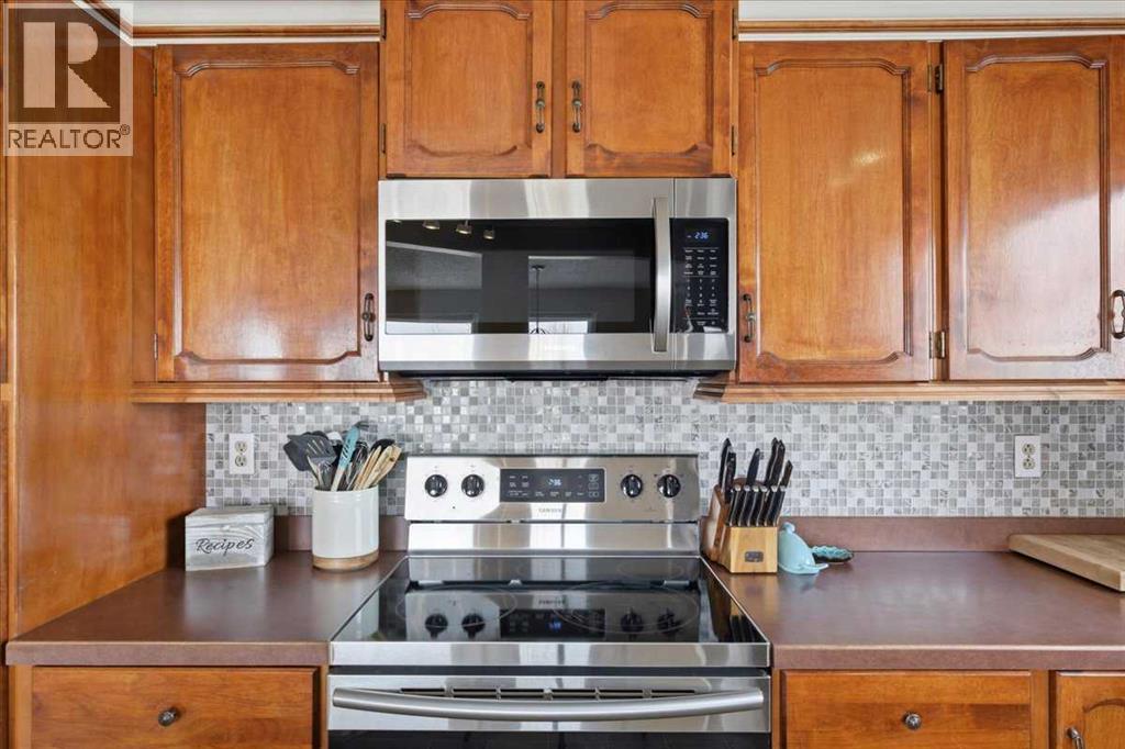 Single Family House Bi-level for Sale in  Macewan Glen Drive NW MacEwan Glen Calgary 