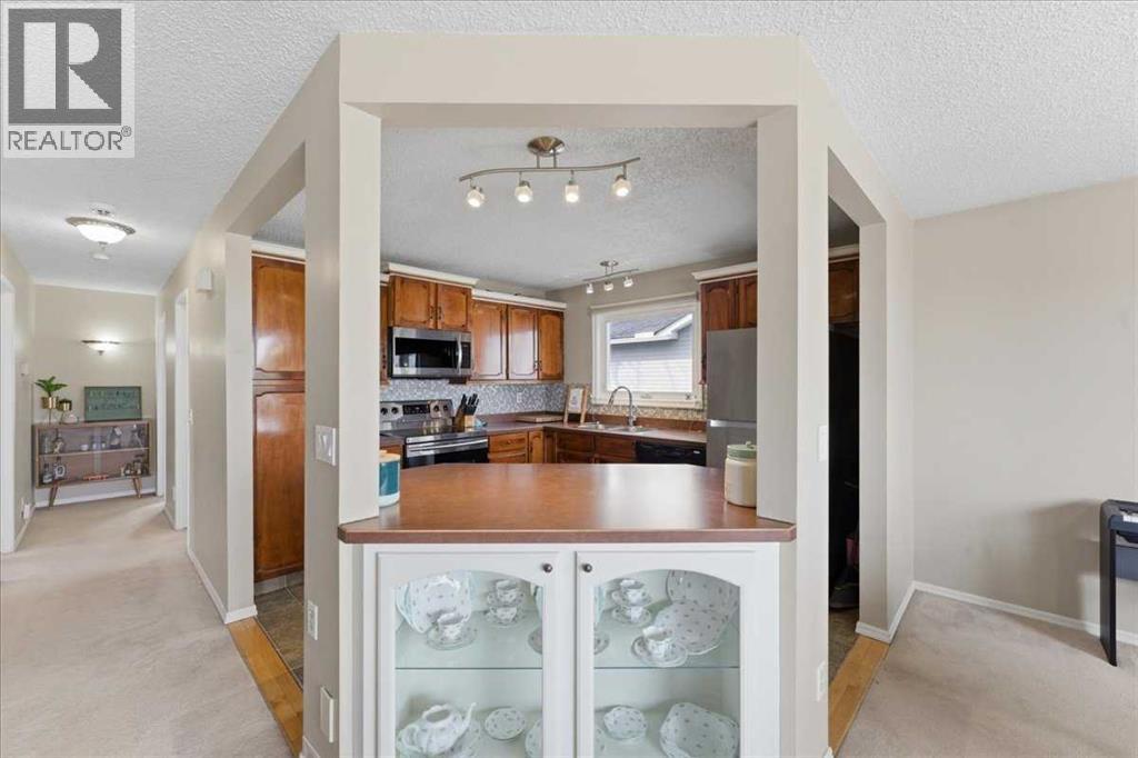 Single Family House Bi-level for Sale in  Macewan Glen Drive NW MacEwan Glen Calgary 