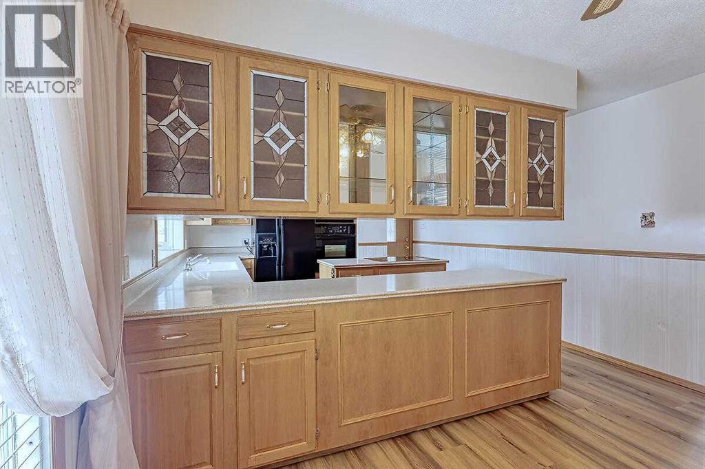 Single Family House Bi-level for Sale in  Woodland Crescent SE Willow Park Calgary 