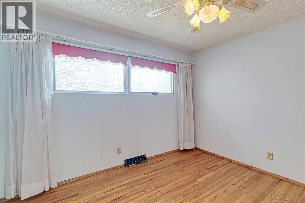 Single Family House Bi-level for Sale in  Woodland Crescent SE Willow Park Calgary 