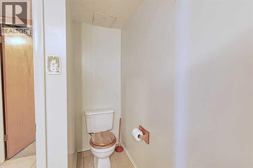 Single Family House Bi-level for Sale in  Woodland Crescent SE Willow Park Calgary 