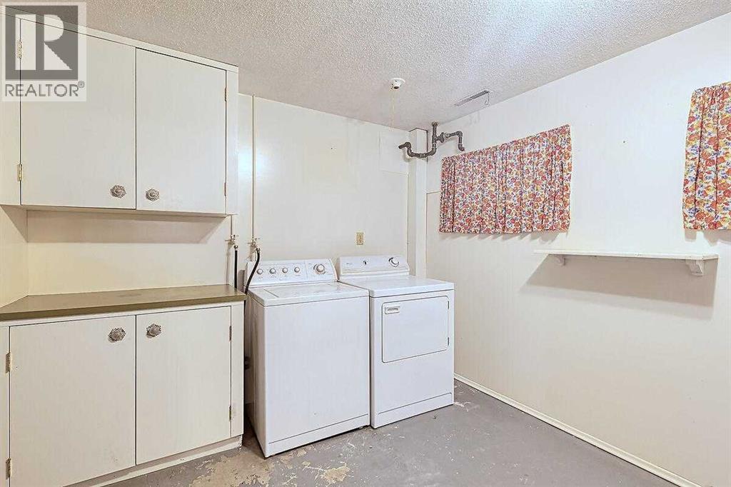 Single Family House Bi-level for Sale in  Woodland Crescent SE Willow Park Calgary 