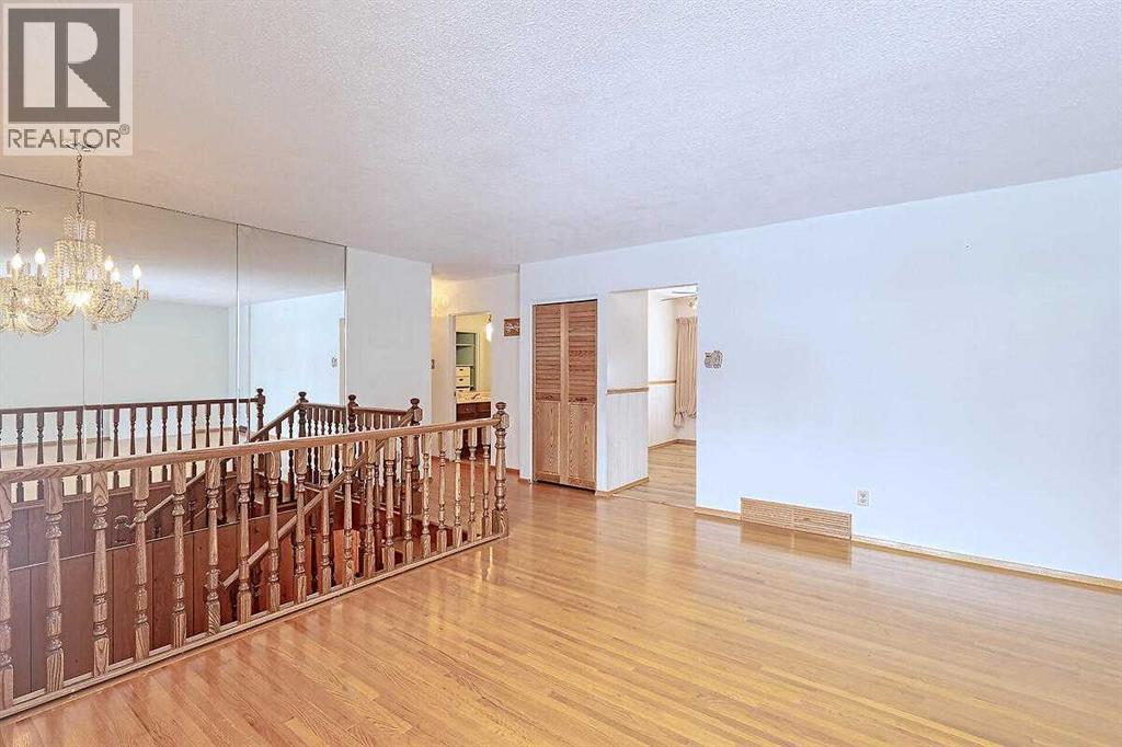 Single Family House Bi-level for Sale in  Woodland Crescent SE Willow Park Calgary 