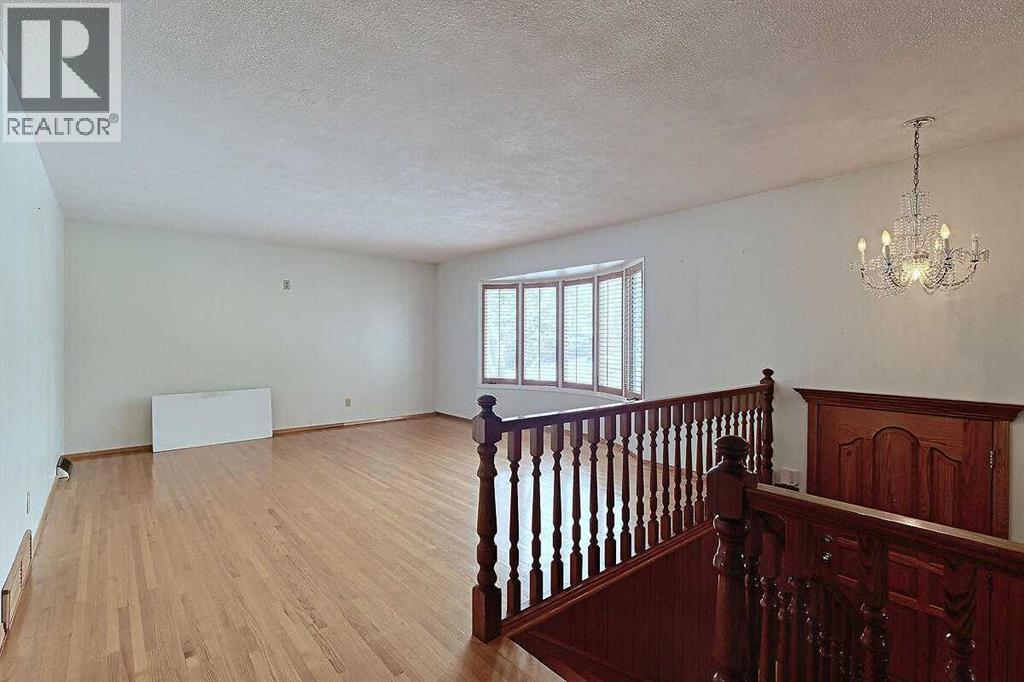 Single Family House Bi-level for Sale in  Woodland Crescent SE Willow Park Calgary 