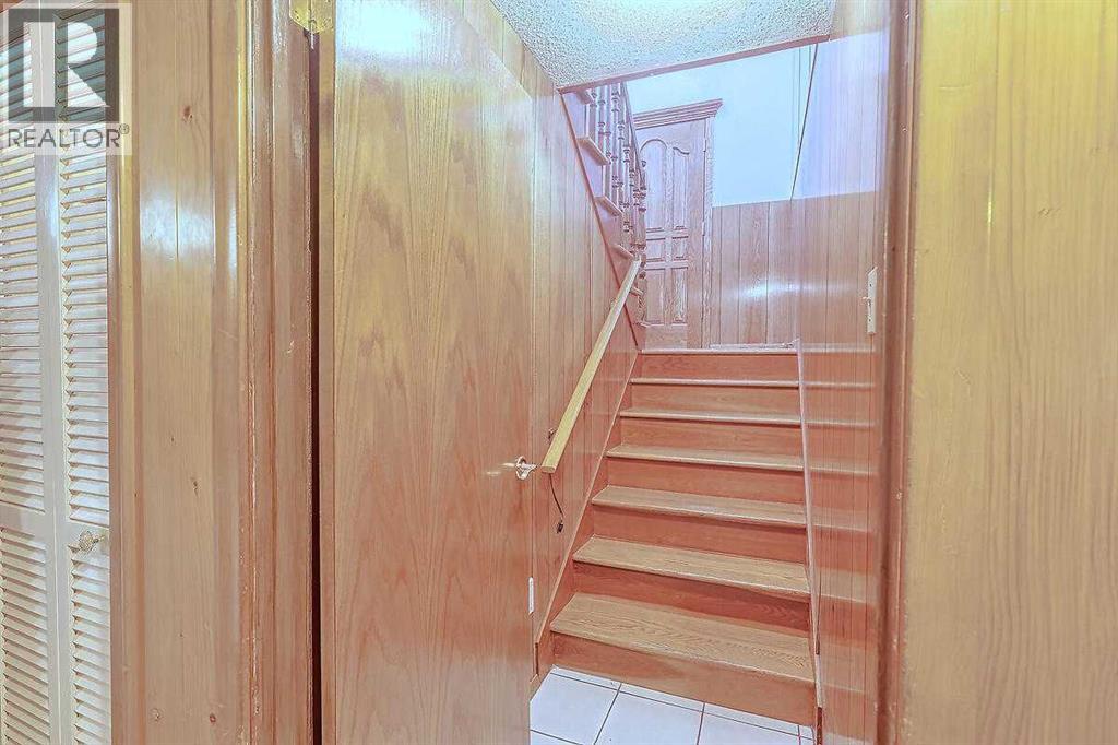 Single Family House Bi-level for Sale in  Woodland Crescent SE Willow Park Calgary 