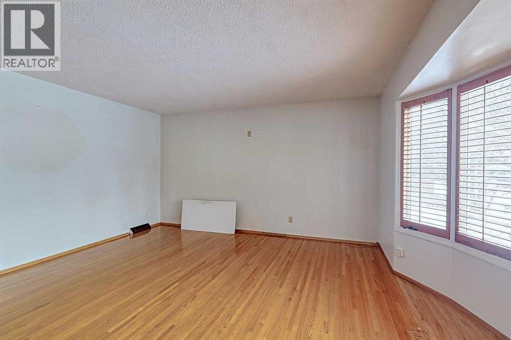 Single Family House Bi-level for Sale in  Woodland Crescent SE Willow Park Calgary 