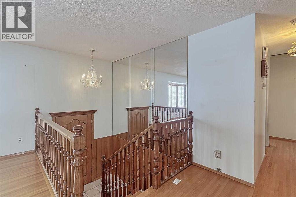 Single Family House Bi-level for Sale in  Woodland Crescent SE Willow Park Calgary 