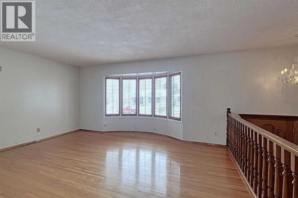 Single Family House Bi-level for Sale in  Woodland Crescent SE Willow Park Calgary 