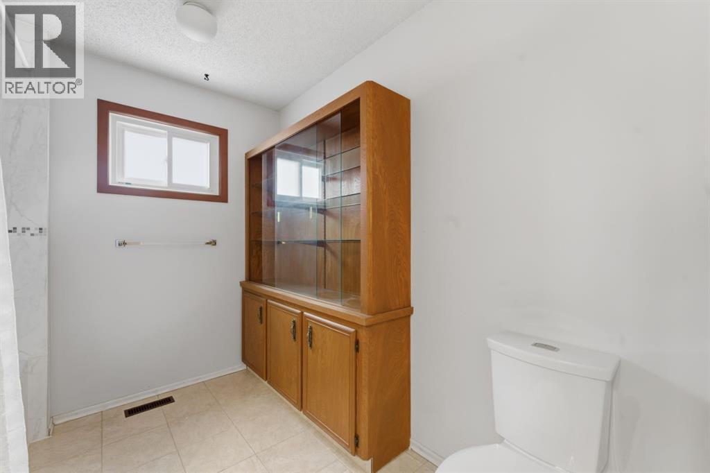 Single Family House 4 Level for Sale in  Woodstock Way SW Woodlands Calgary 