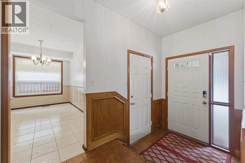 Single Family House 4 Level for Sale in  Woodstock Way SW Woodlands Calgary 