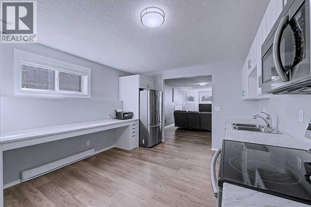 Single Family House Bi-level for Sale in  Sunlake Circle SE Sundance Calgary 