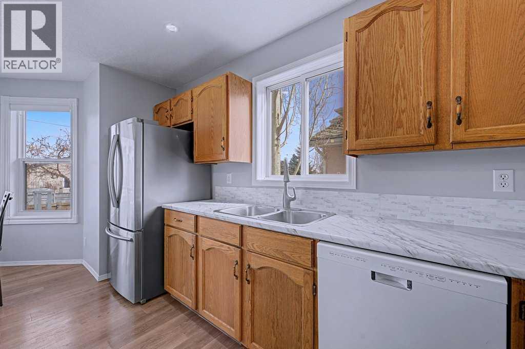 Single Family House Bi-level for Sale in  Sunlake Circle SE Sundance Calgary 