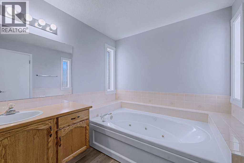 Single Family House Bi-level for Sale in  Sunlake Circle SE Sundance Calgary 