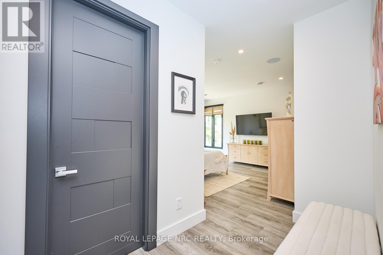 Expansive primary suite with lake