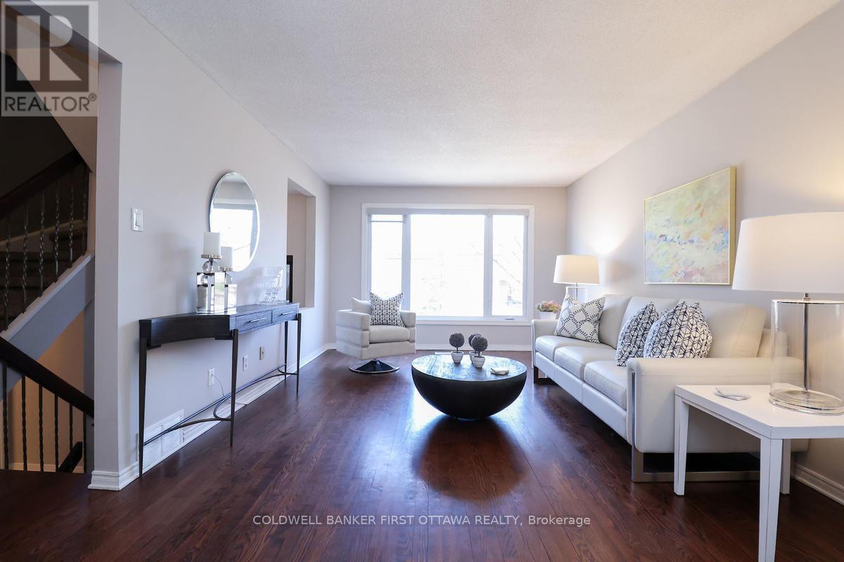 Main lvl living room w expansive window.