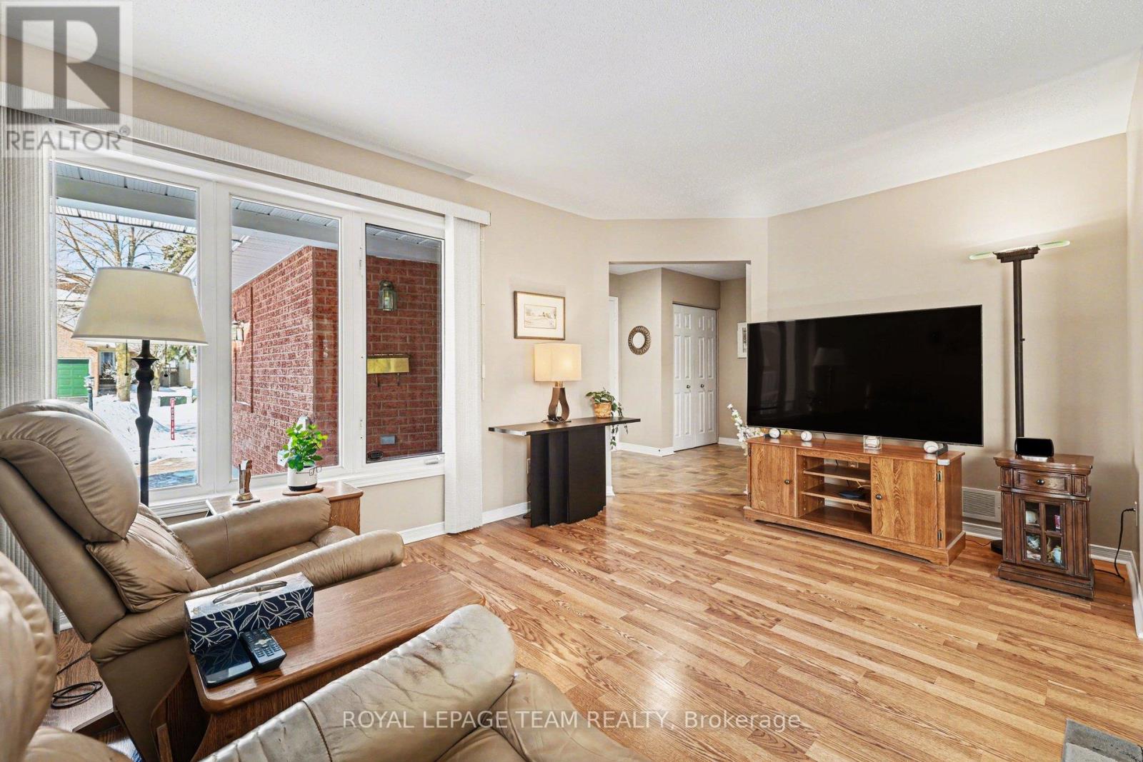 Living room towards foyer and porch