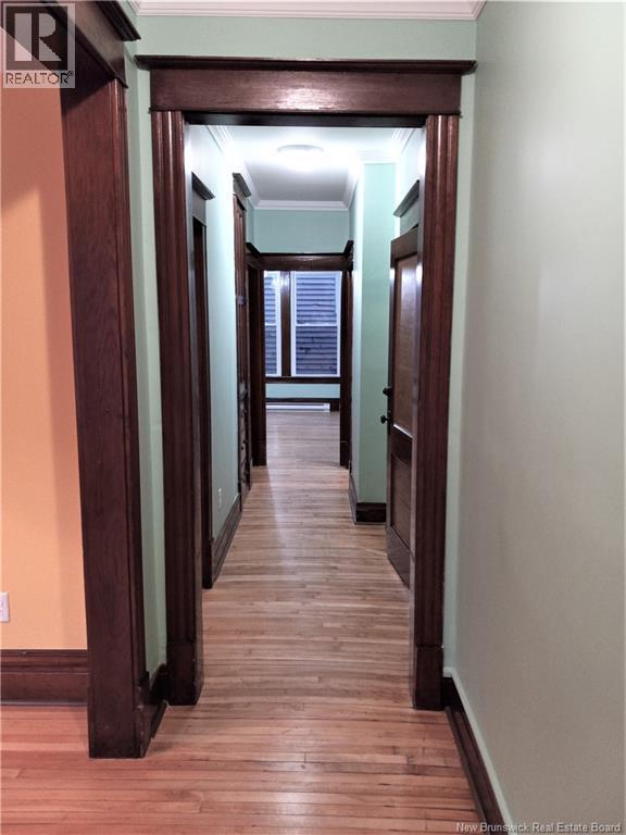 Main floor hallway from front to dining room in rear.