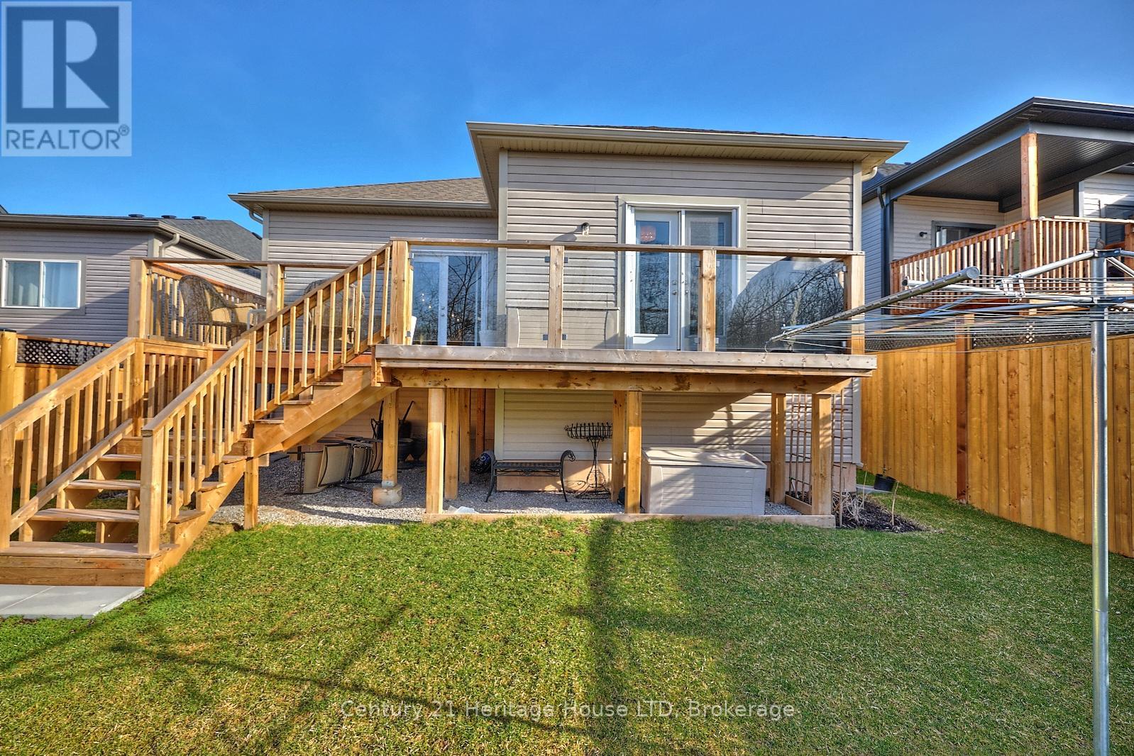 Rear Exterior - Home & Deck From Yard