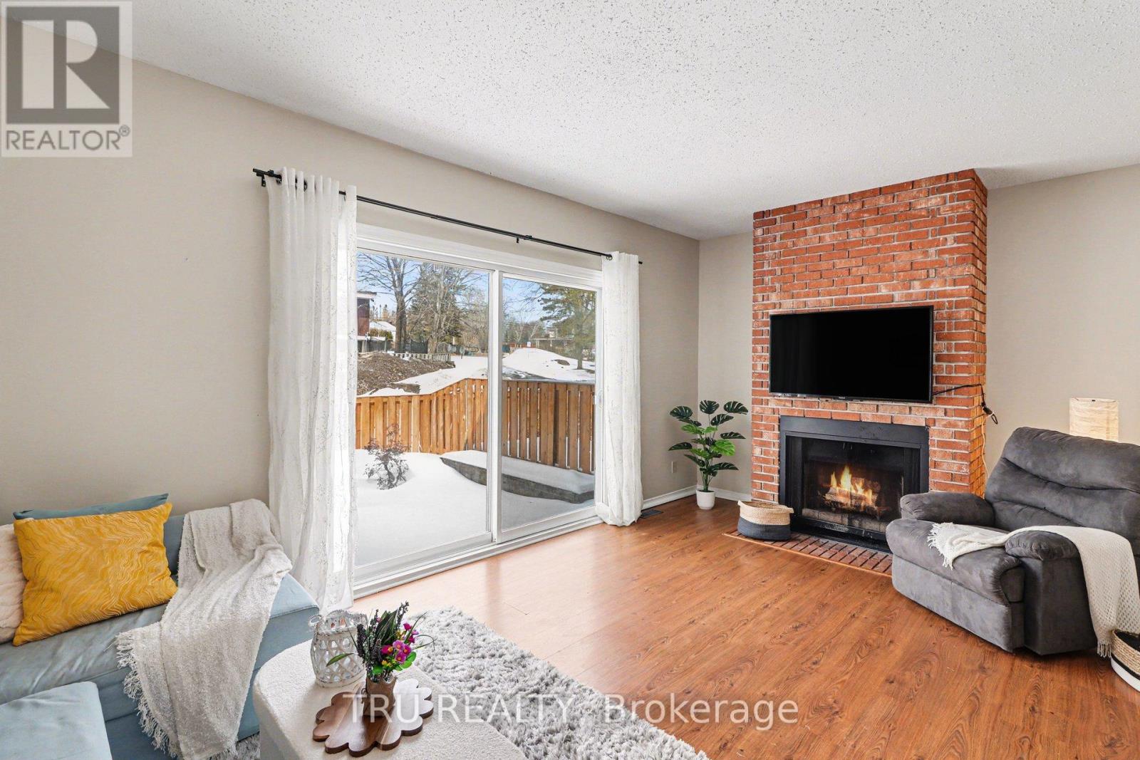 Warm inviting living room with wood fireplace