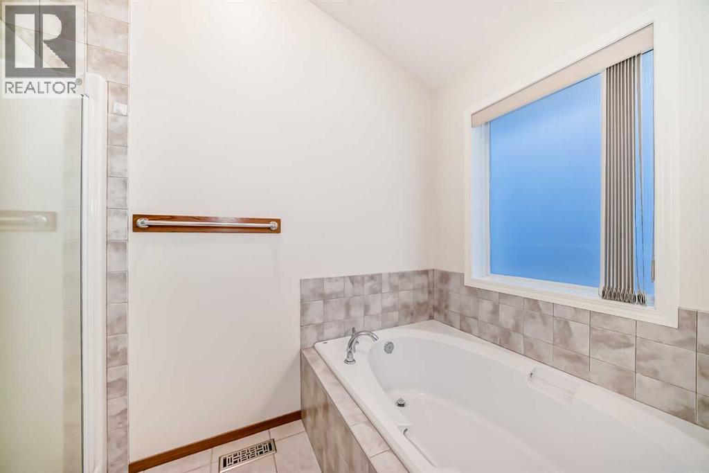 Single Family House Bungalow for Sale in  Cougartown Close SW Cougar Ridge Calgary 