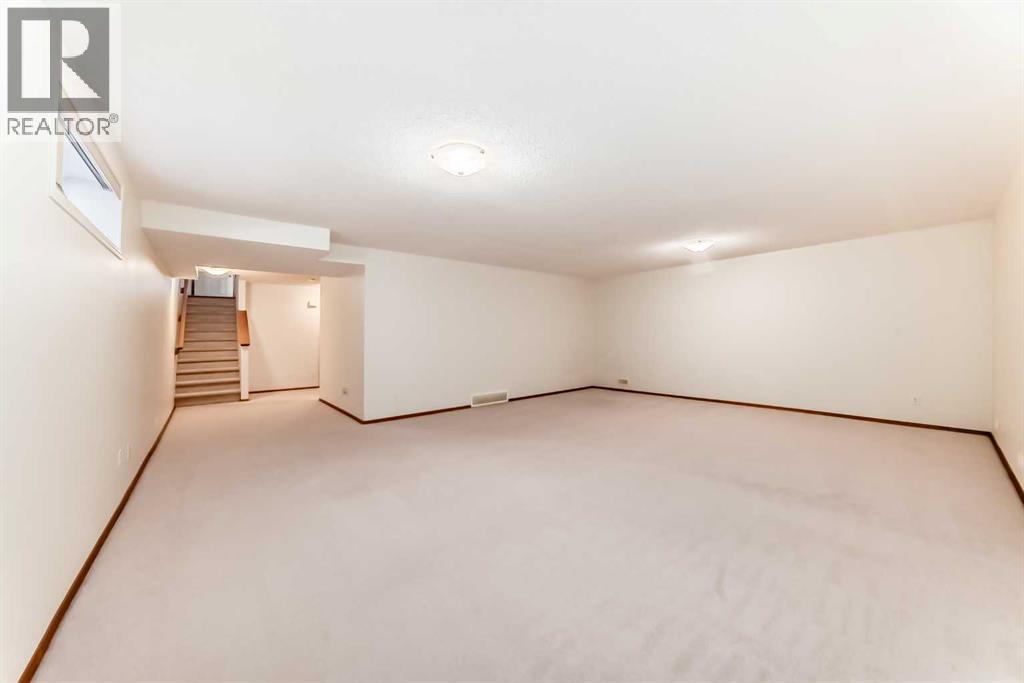 Single Family House Bungalow for Sale in  Cougartown Close SW Cougar Ridge Calgary 