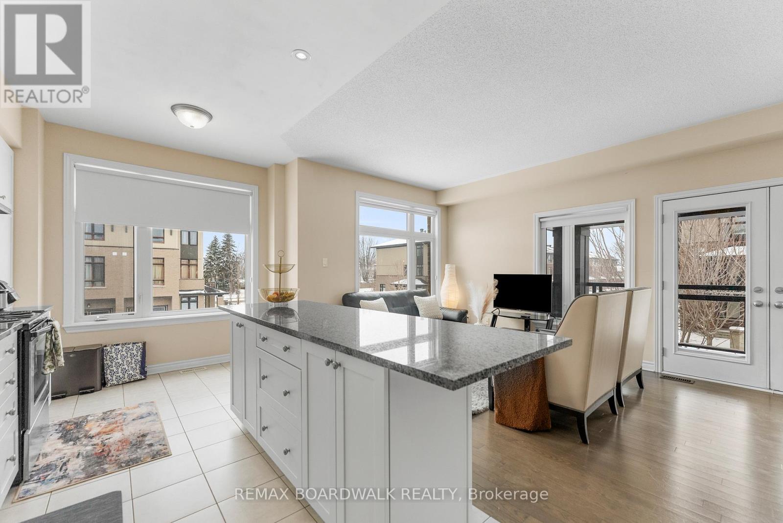 Breakfast bar at island with Granite counters