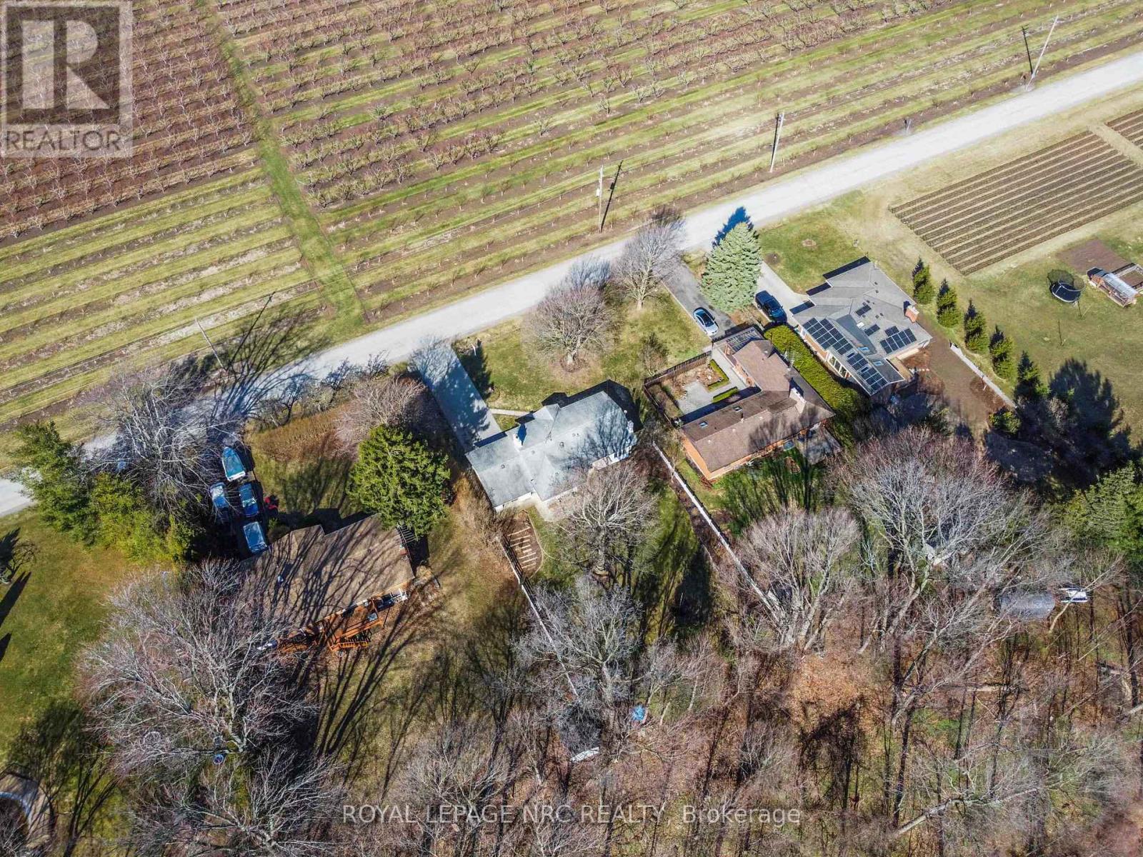 Aerial of Front Yard and Peach Tree Orchards