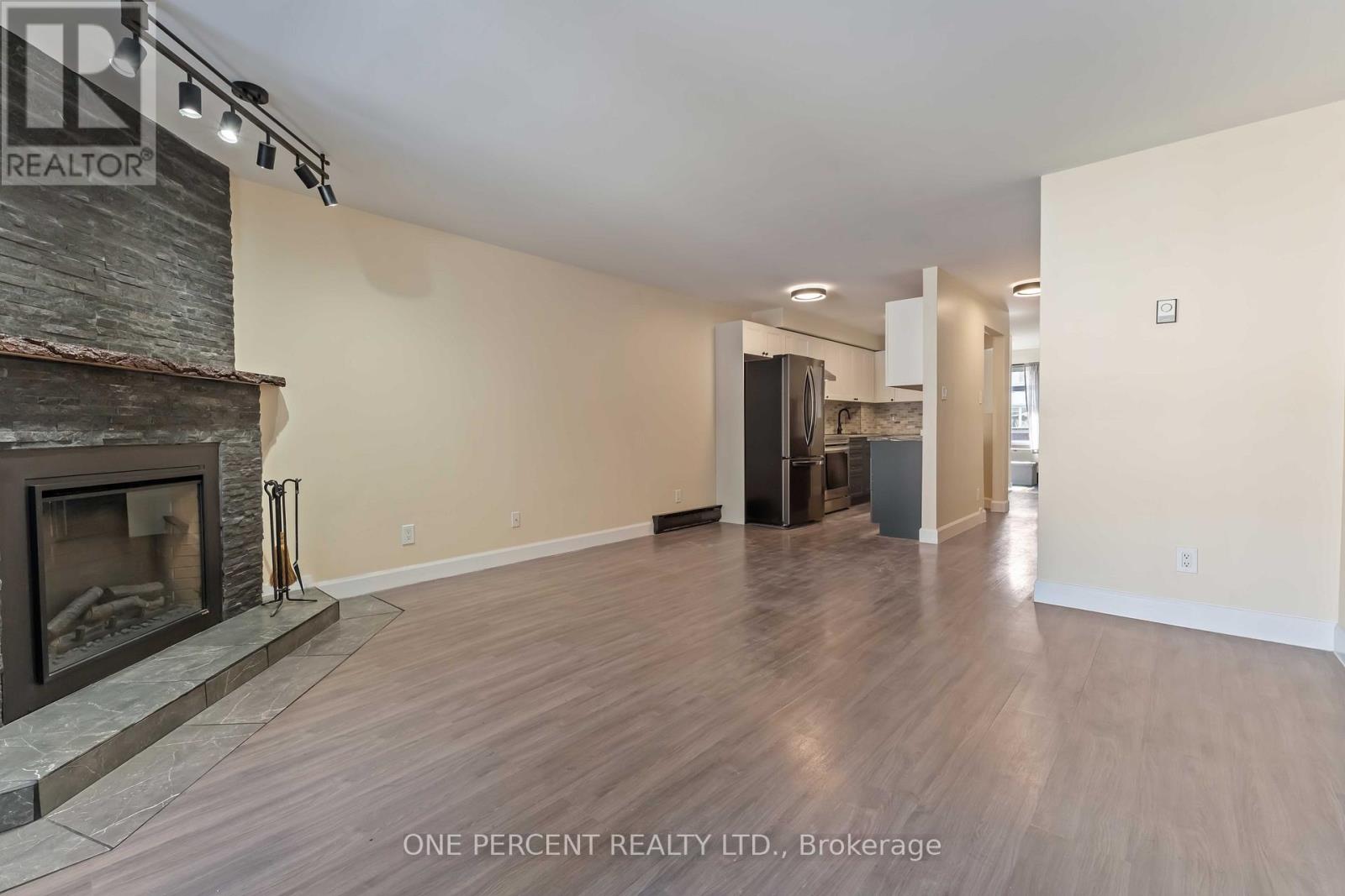 Living room overlooking dining room and kitchen