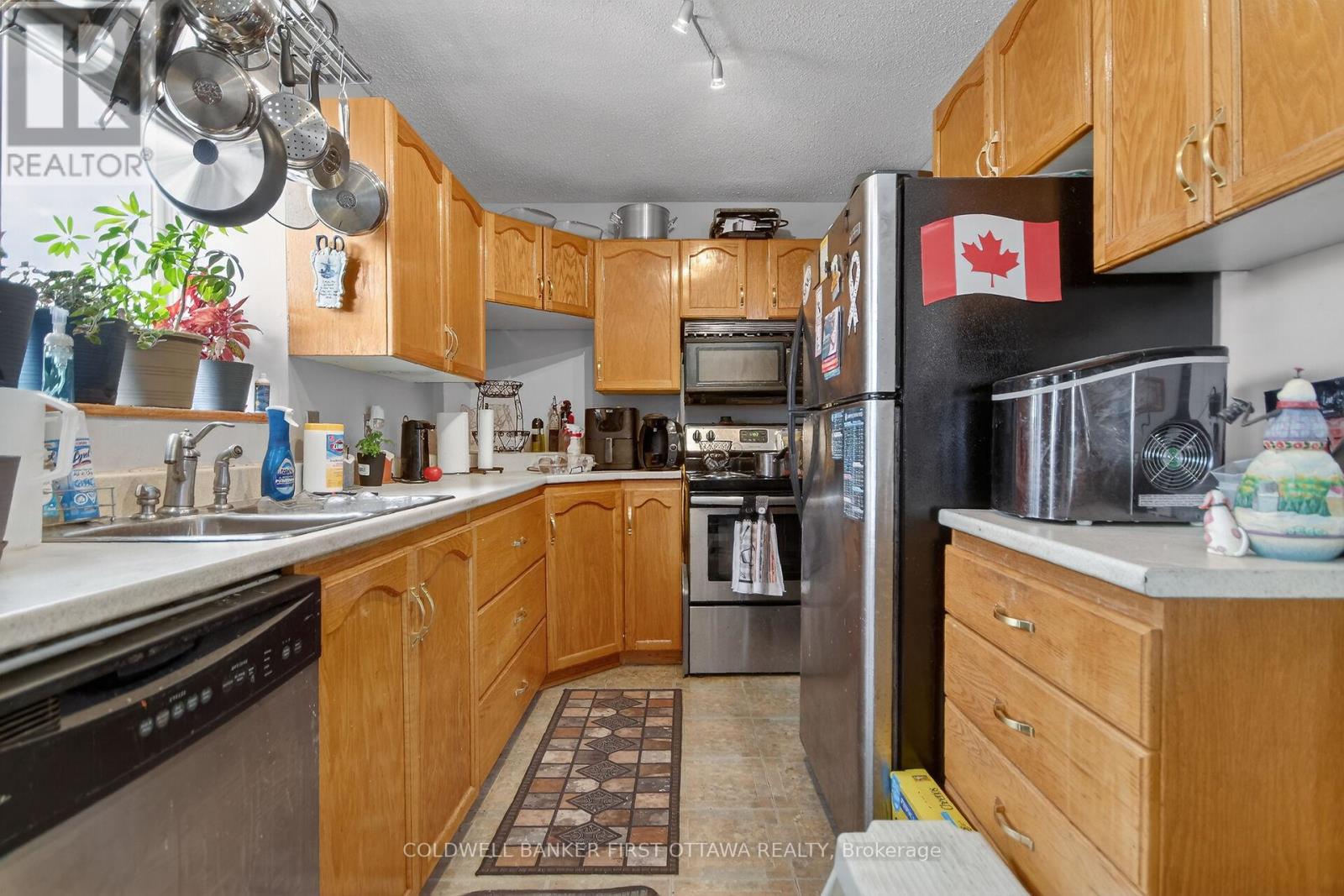 Galley style kitchen w/window overlooking sideyard