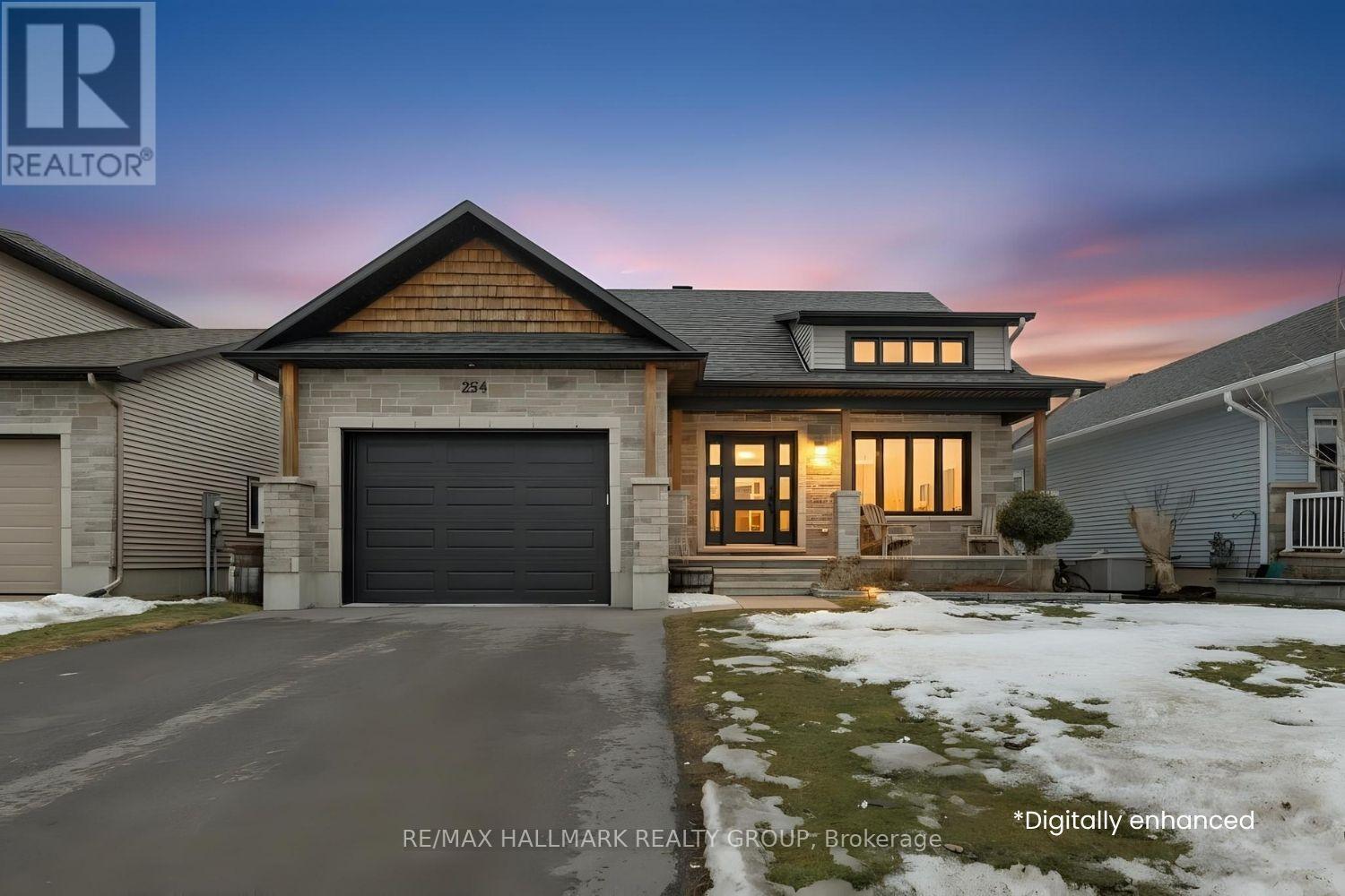Twilight curb appeal with stone exterior