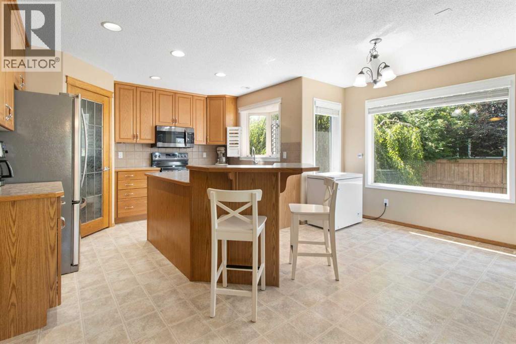 Single Family House for Sale in  Everwillow Close SW Evergreen Calgary 