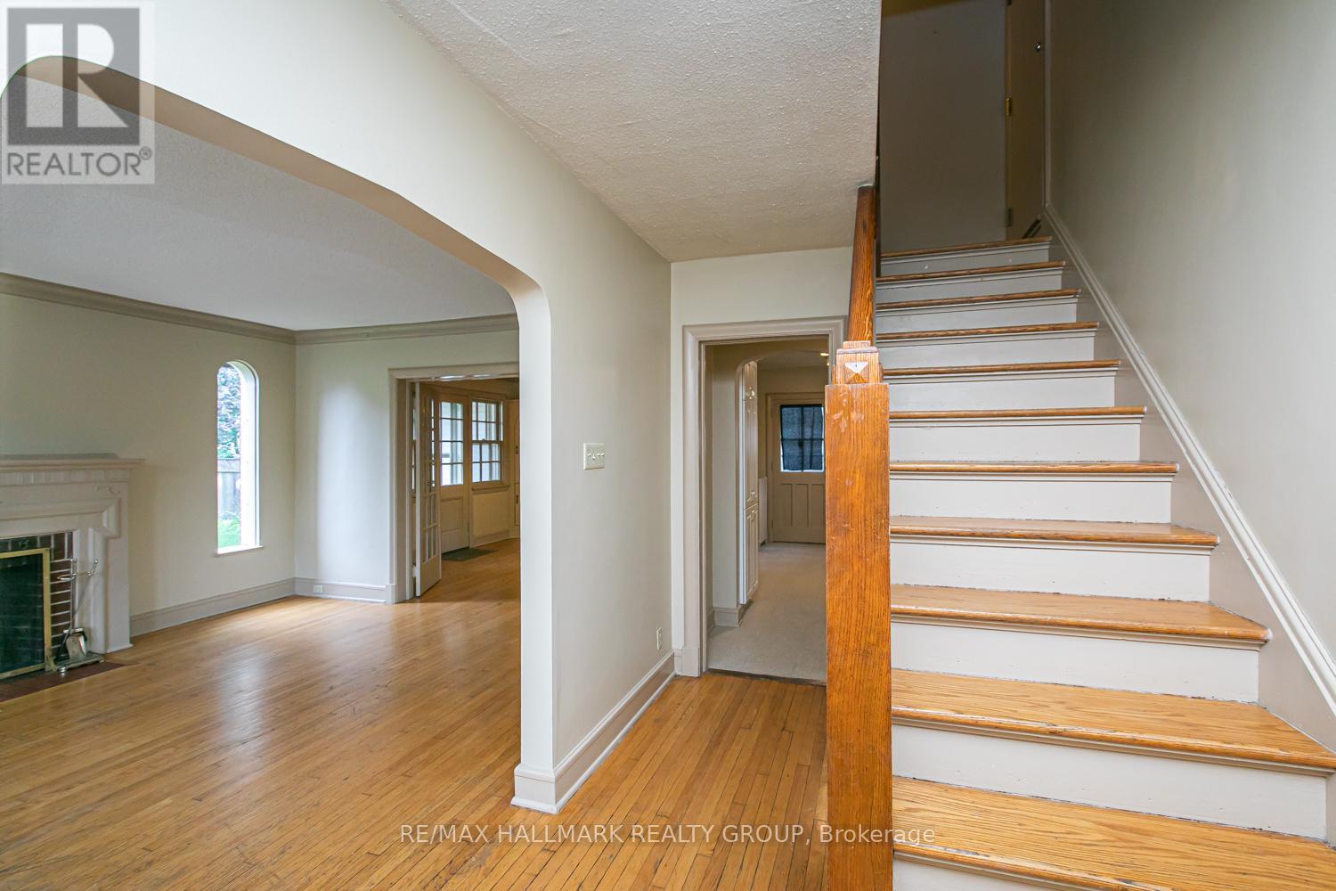 Stairs to second floor and living room