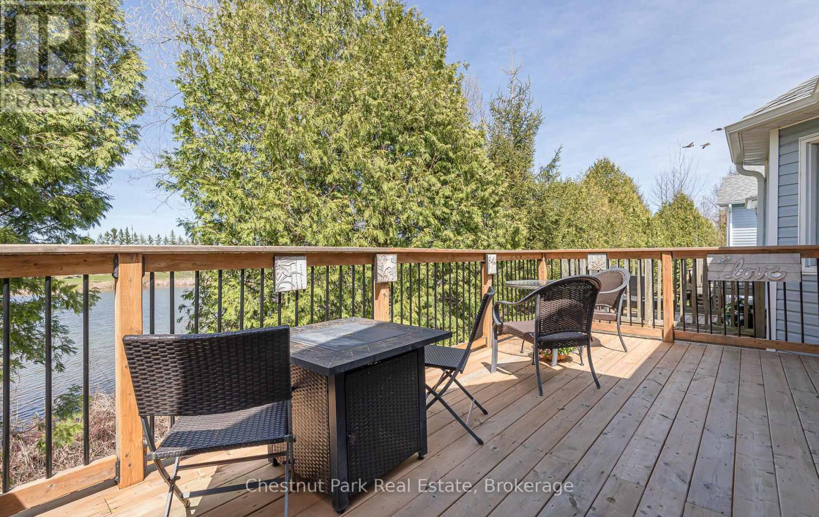 Upper back deck overlooking pond and golf course