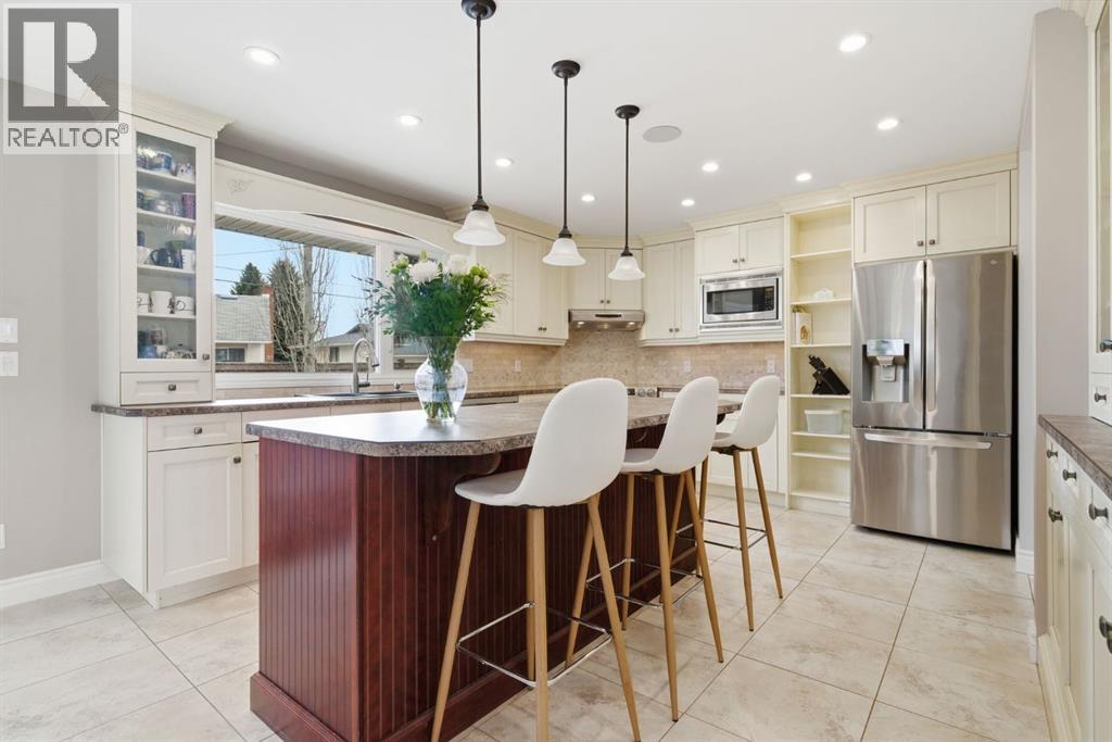 Single Family House 4 Level for Sale in  Lake Lucerne Drive SE Lake Bonavista Calgary 