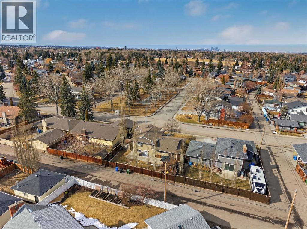 Single Family House 4 Level for Sale in  Lake Lucerne Drive SE Lake Bonavista Calgary 