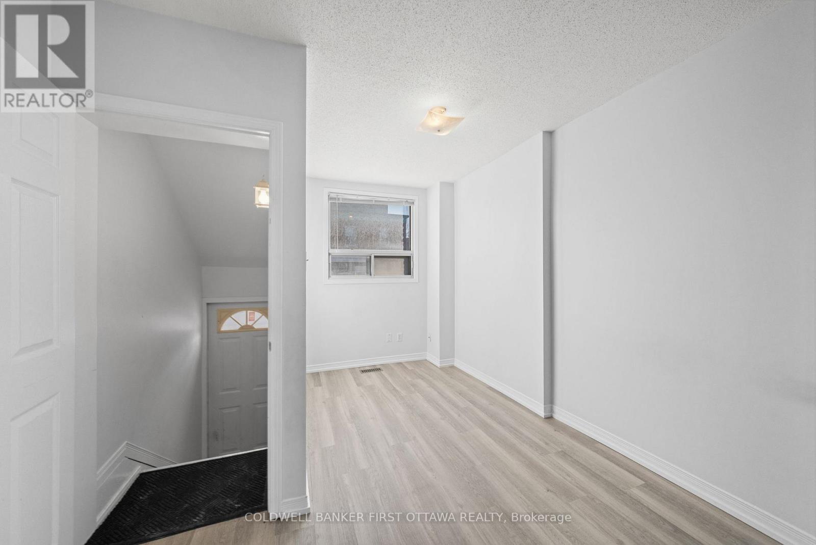 Front entrance w steps up to privacy door.