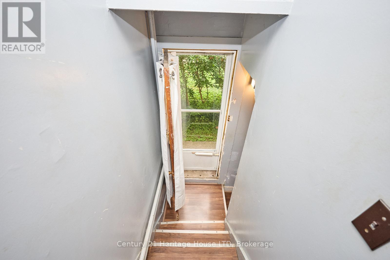 Staircase leading to side door