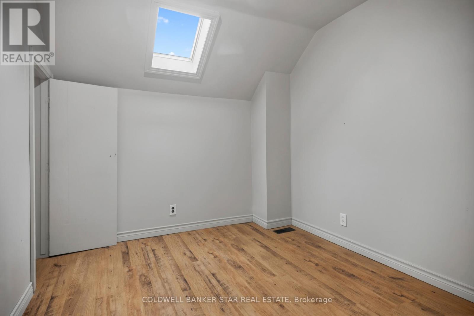 Unit 1 bedroom with skylight.