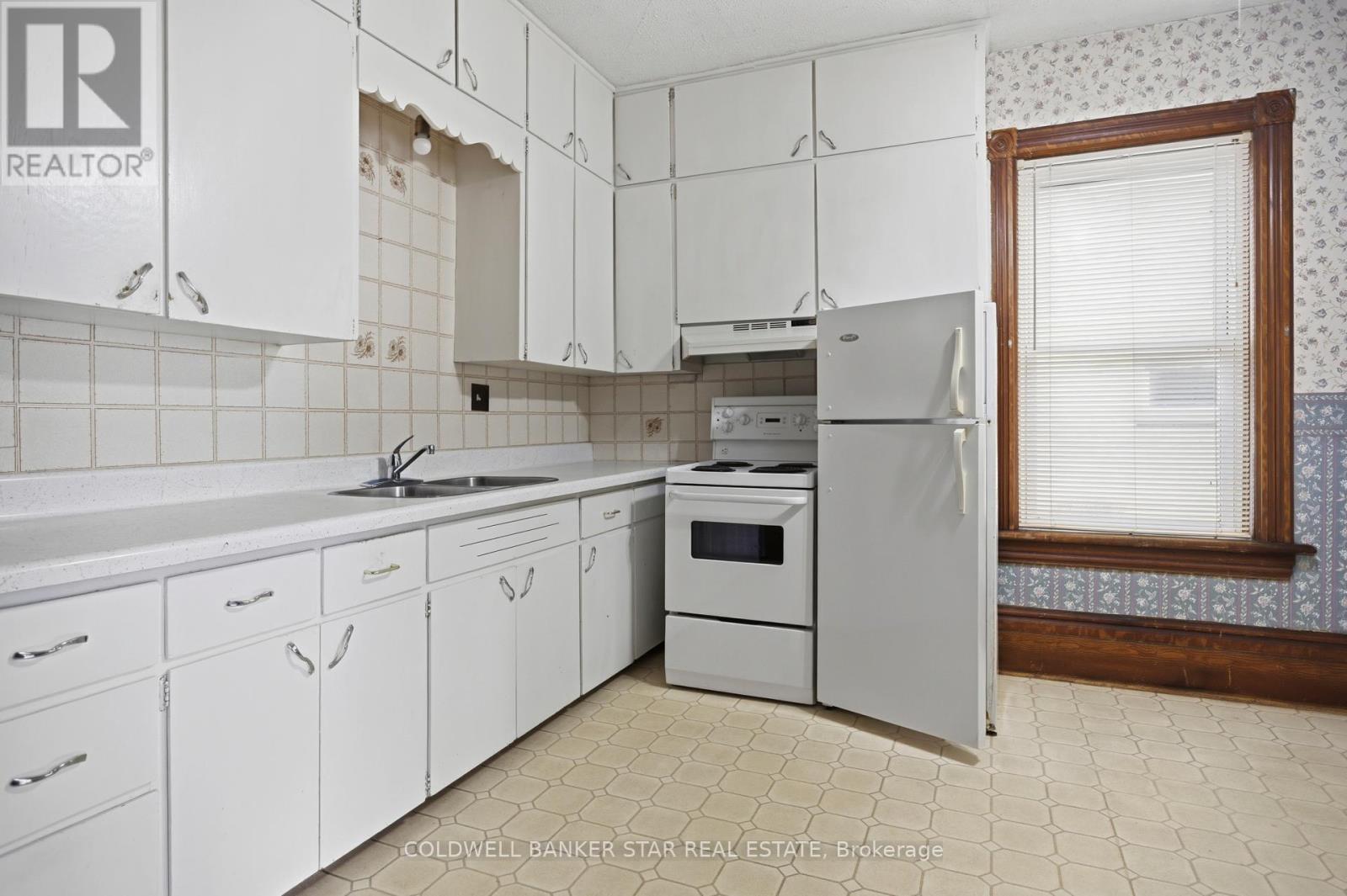 Unit 2 - Lots of windows make kitchen bright.