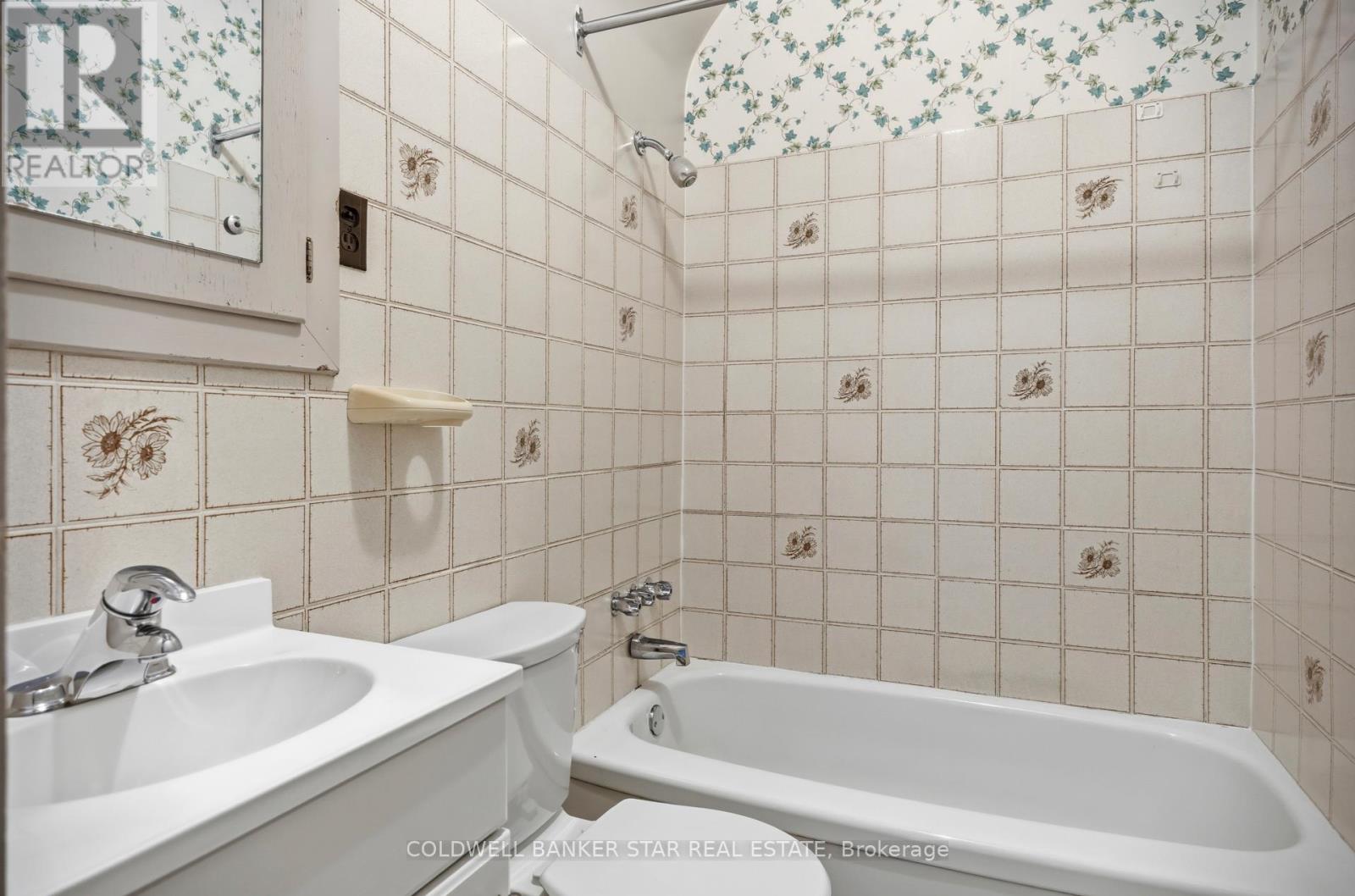 Unit 2 bathroom with separate shower.