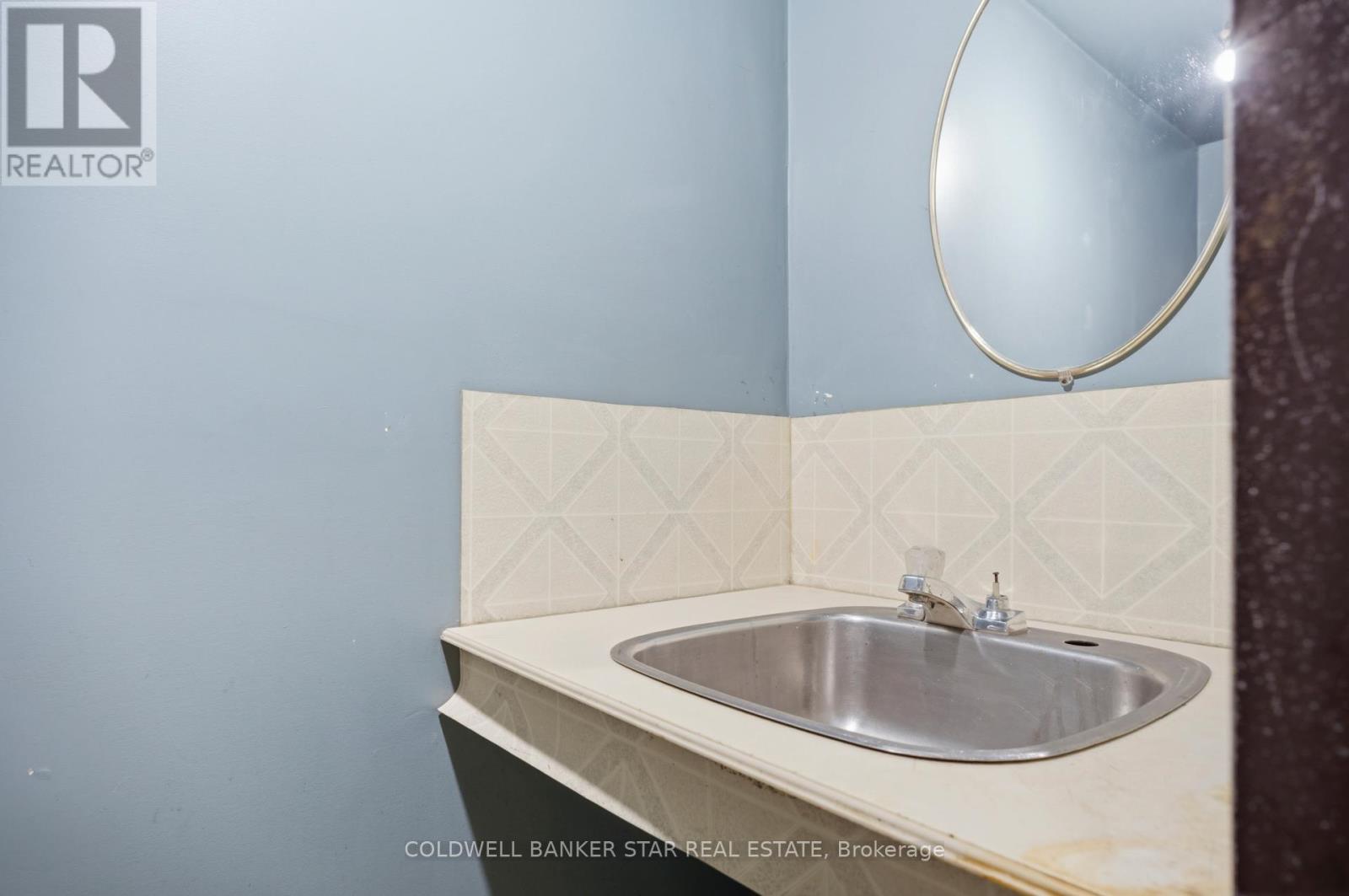 Shop includes toilet and sink.