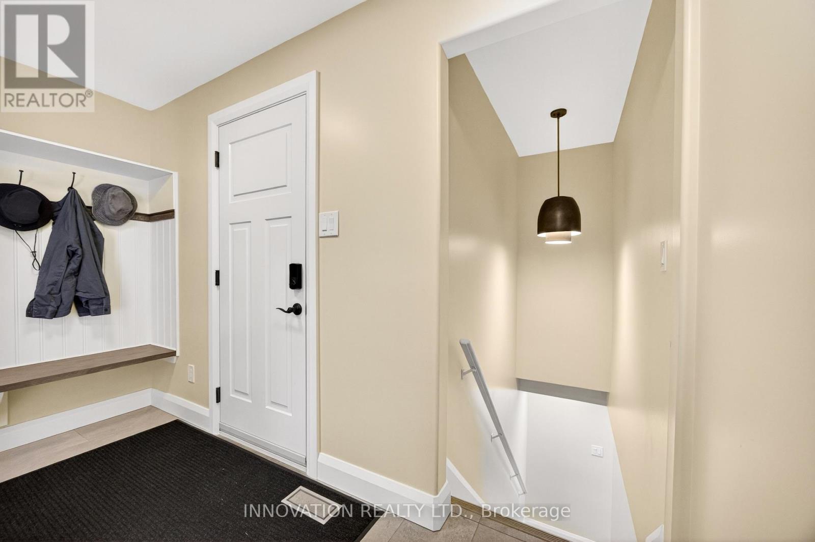 Mudroom with garage and second basement access