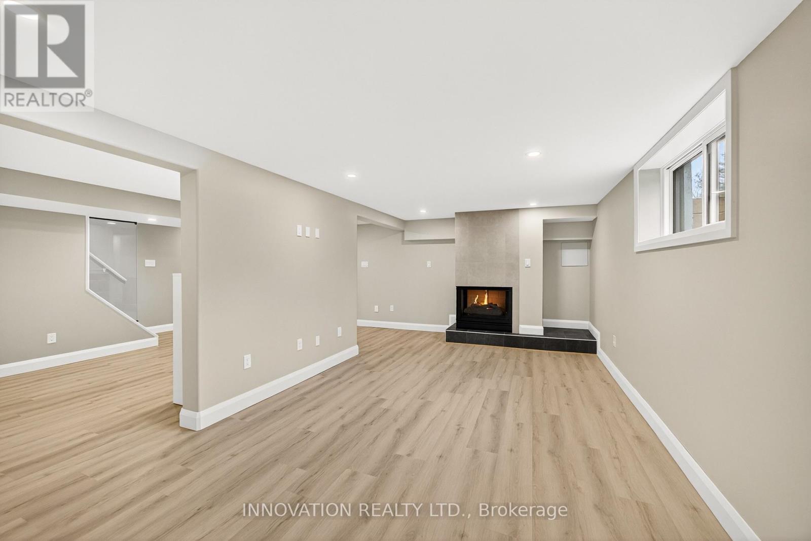 Living room with large windows and gas fireplace