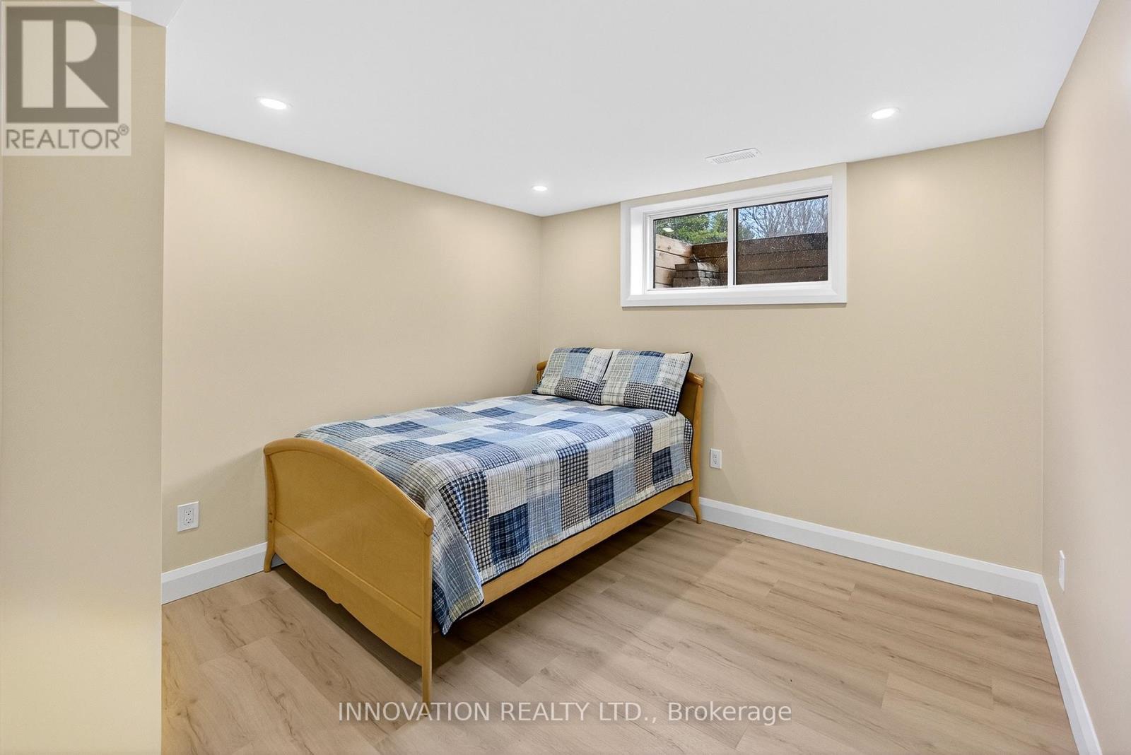 Third bedroom with large window and potlights