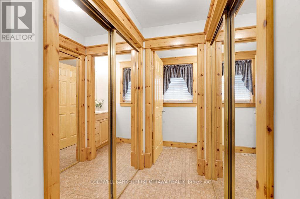 Mudroom has two walls of closets