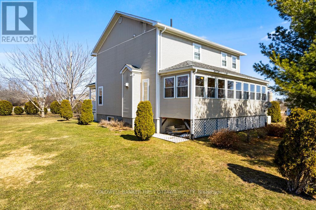 Three-season sunroom-porch overlooks back yard