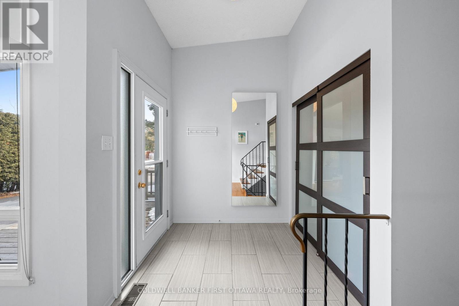 Bright & welcoming tiled front foyer.